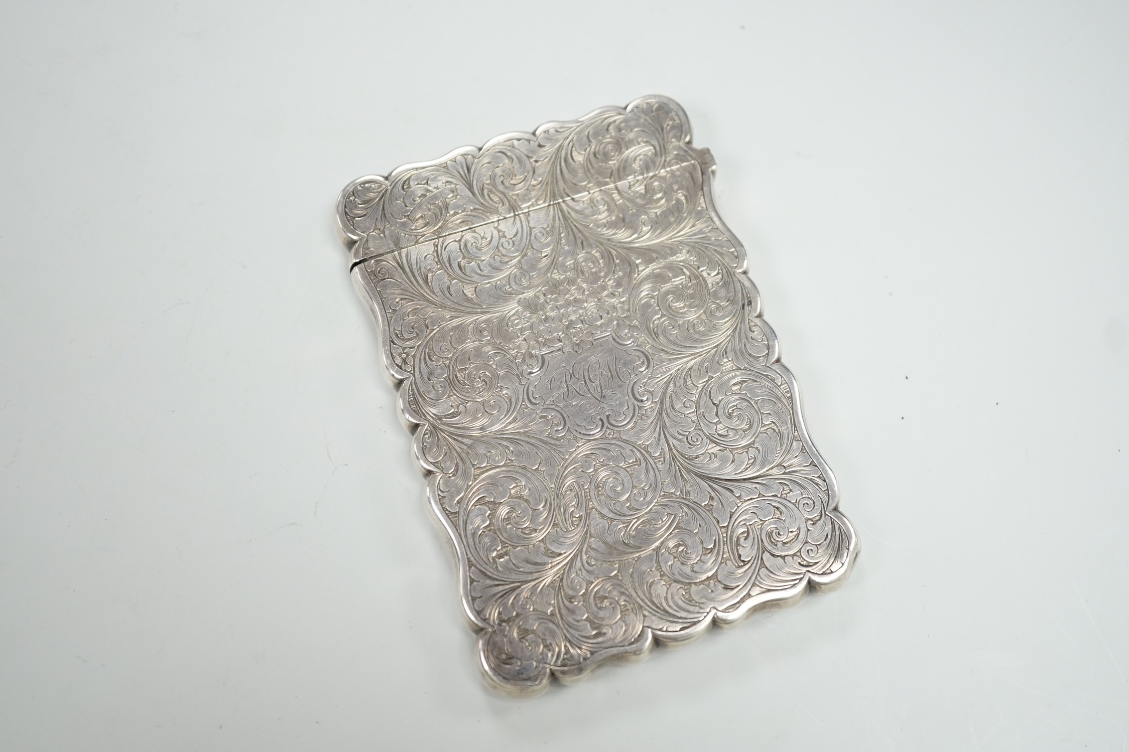 A Victorian silver card case by Nathaniel Mills, the front panel engraved with The Scott Memorial, Birmingham, 1848, 9.9cm.